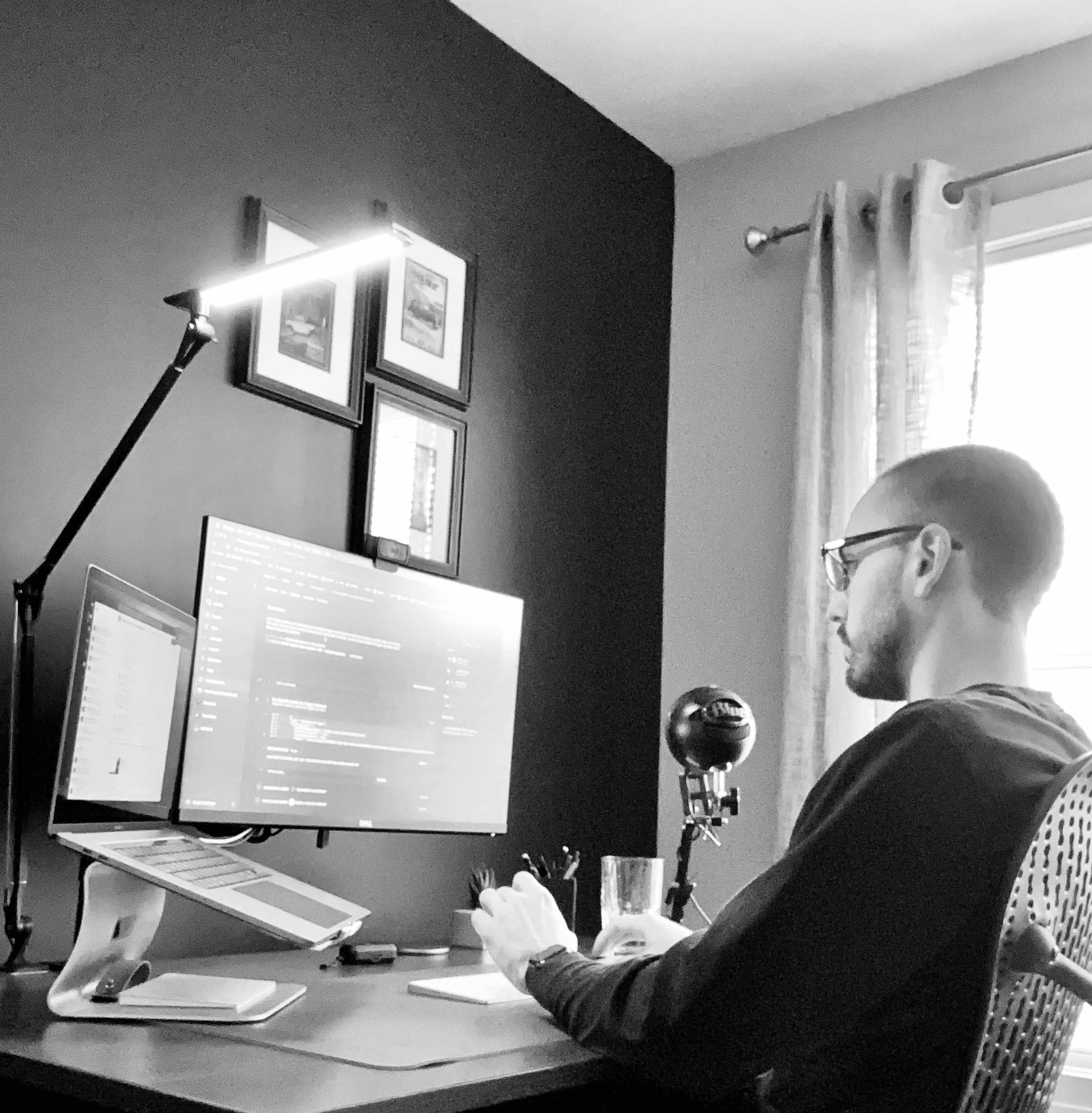 at the desk, deep in code